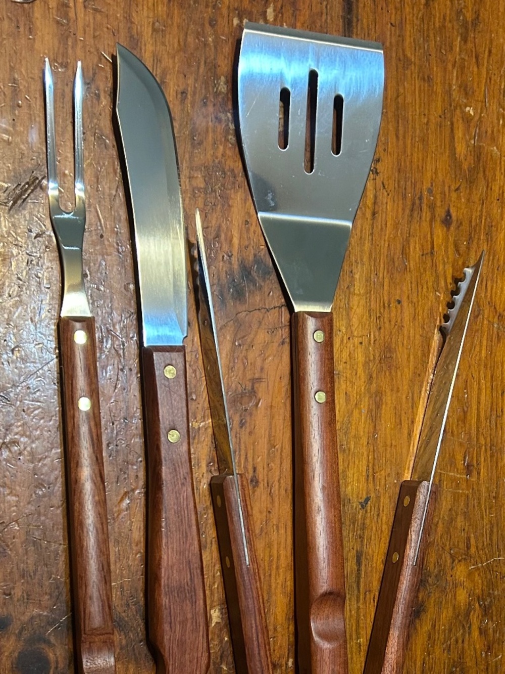 Unused set of brookstone grilling utensils spatula, fork, tongs, knife